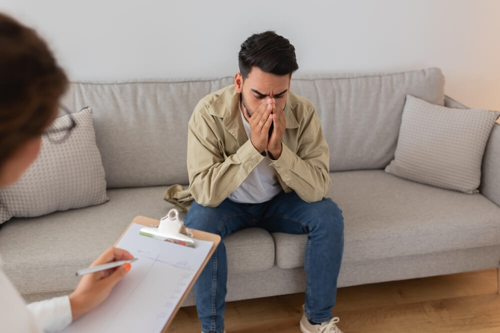 Man with PTSD speaking to a therapist after a car accident – PTSD lawyer in Vancouver can help