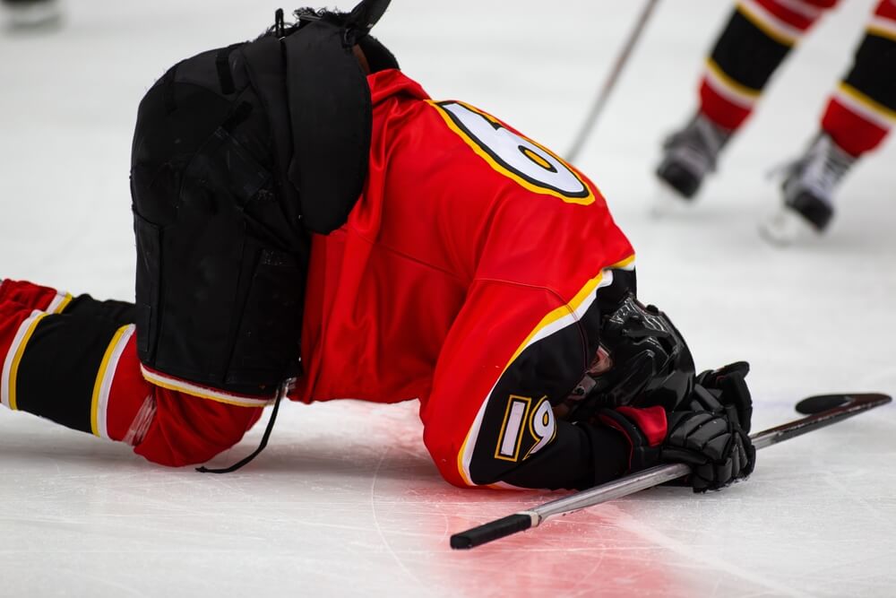 Hockey player injured on ice during game in BC – hockey injury claim scenario