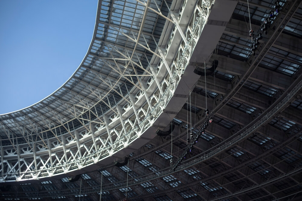 Overhead stadium lighting and roof equipment posing falling object injury risks in BC
